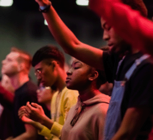 Image of people during worship at Church