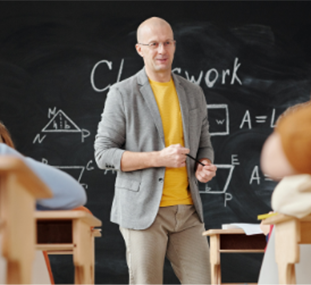 A professor lecturing in front of a classroom