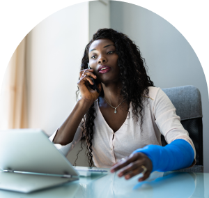 Woman on the phone with a cast on her arm